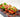 Hassleback tomatoes with shalow slices through them have the slices stuffed with Halal beef bacon, lettuce, halal chicken bologna, avocado, and cheese.