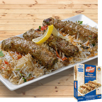 Chicken kababs rest on a bed of biryani rice, they are garnished with a strip of lemon. In the bottom right hand corner is an image of the product package