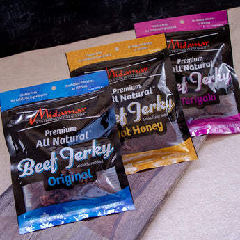 3 packages of Midamar beef jerky. one is original flavor, one is hot honey, and the last is beef teriyaki