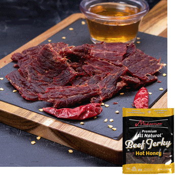 Midamar halal beef jerky strips sit on a cutting board surrounded by dried peppers and seeds, behind the jerky is a clear cup of honey overlayed is a picture of the package