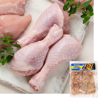 3 Raw halal chicken legs on a painted white board of wood. Sprigs or a herb are to the left and above the drumsticks. A pack of Midamar chicken drumsticks is overlayed in the bottom corner