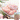 Raw chicken thighs sitting on parchment paper. The chicken is garnished with herbs. A Package of Midamar Halal Chicken Thigh is overlaid in the bottom right corner