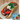 Gyro sandwich with ingredients on a plate, featuring Midamar Gyros packaging.