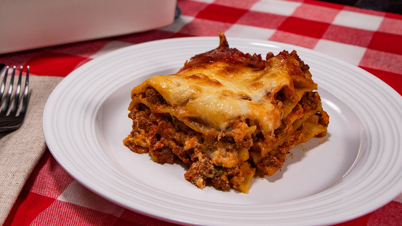 Classic halal ground beef lasagna with ricotta bechamel and mozzarella layered golden for family casserole dinner