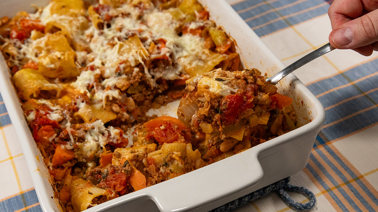 Cheesy halal ground beef pasta bake with tomato sauce mozzarella cheddar golden bubbling for family casserole
