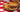 A juicy Halal Burger stuffed with jalapeno, cheese, Halal beef bacon, and cream cheese, served alongside cool, creamy elote corn salad.
