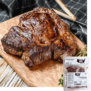 A halal chuck roast with char on a wood cutting board with a sprig of thyme. A package of United steaks chuck roast is overlayed in the bottom right corner. 