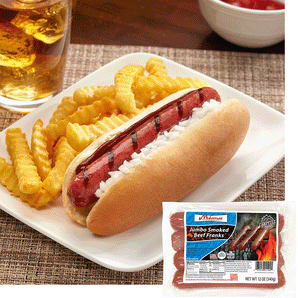A grilled midamar jumbo campfire griller in a bun with bbq sauce. Beside it rests a small pile of french fries and a tea. In the right hand corner is an image of a package of the product