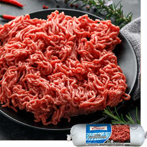 Ground lamb on a plate with a package of ground lamb in the foreground, featuring the brand Midamar