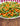 a large shallow plate covered with peas, green beans, and diced carrots