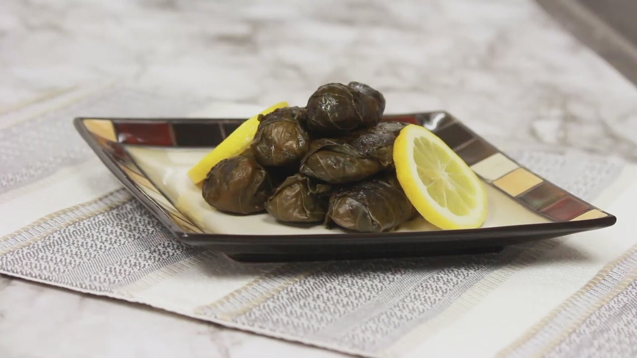 a video showing how to make stuffed grape leaves using midamar products