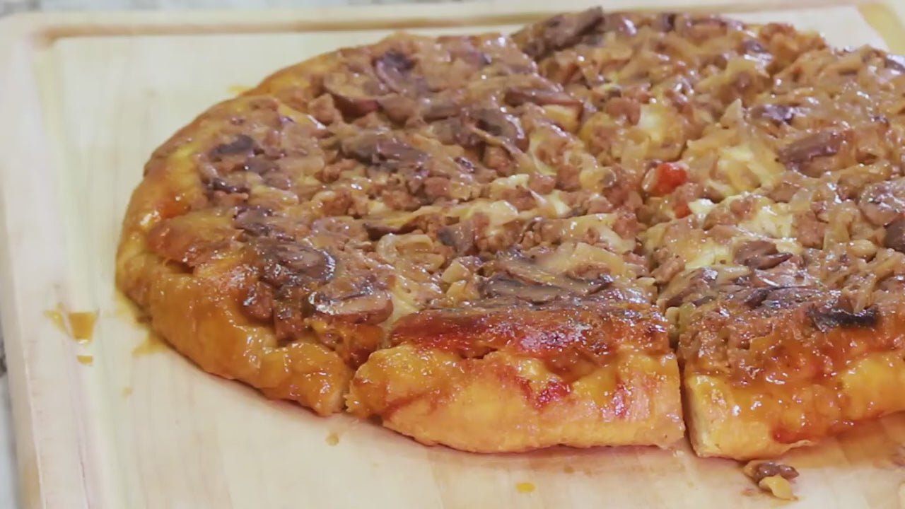 a video showing how to make upside down sausage and mushroom pizza in a cast iron skillet 
