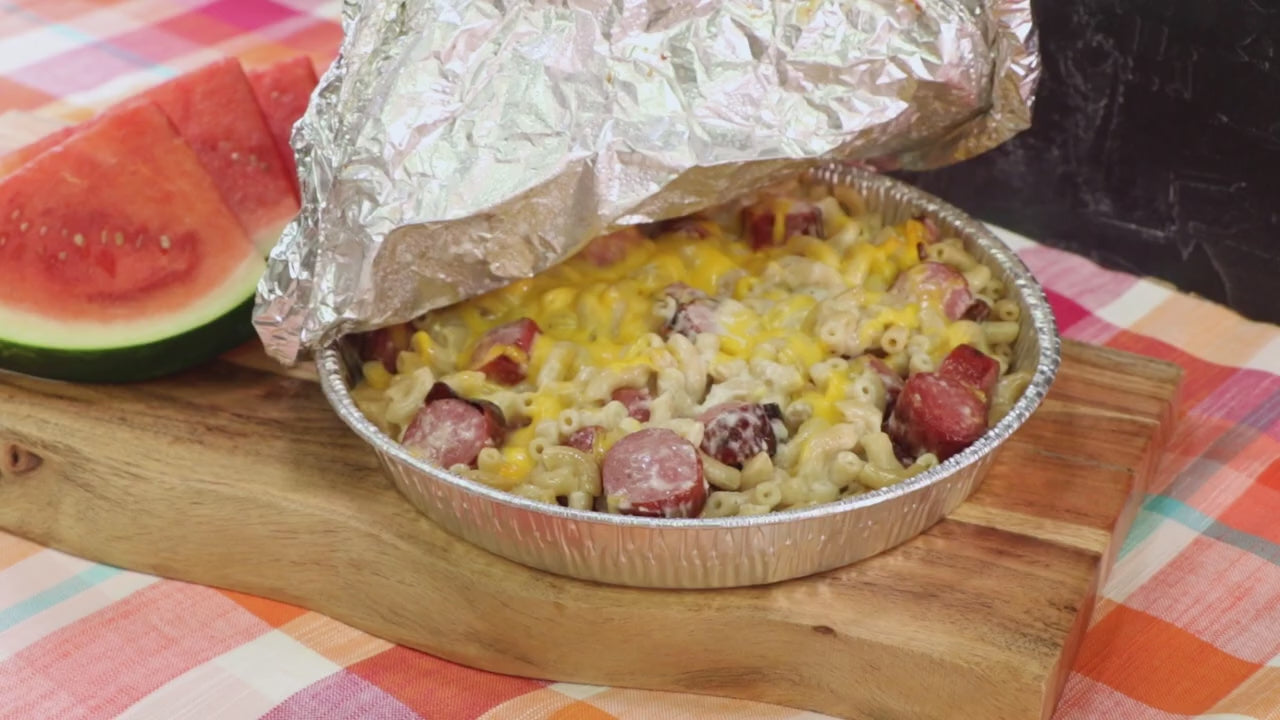 a video showing how to make mac and cheese with smoked beef franks for camping