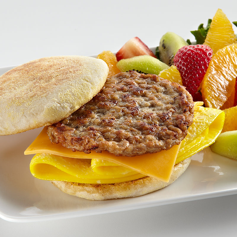 Homemade halal beef breakfast patties browned and juicy from the freezer in a meal prep container